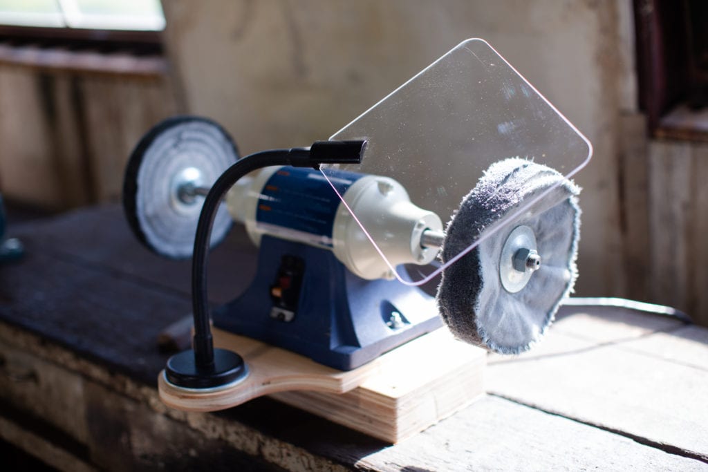 Bench grinder with flexarm protective shield and lamp