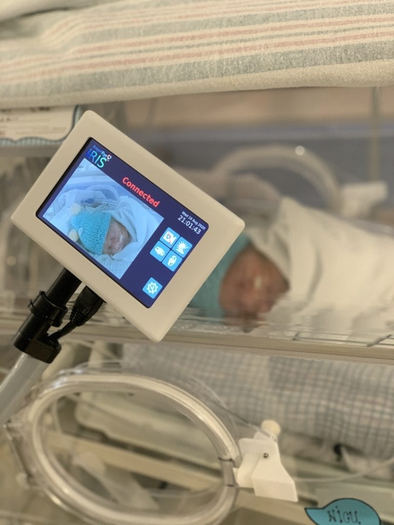 Video baby monitor positioned perfectly to keep watch on a newborn