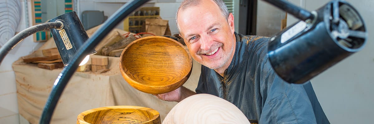 Kent Weakley using a flex arm lamp for woodturning